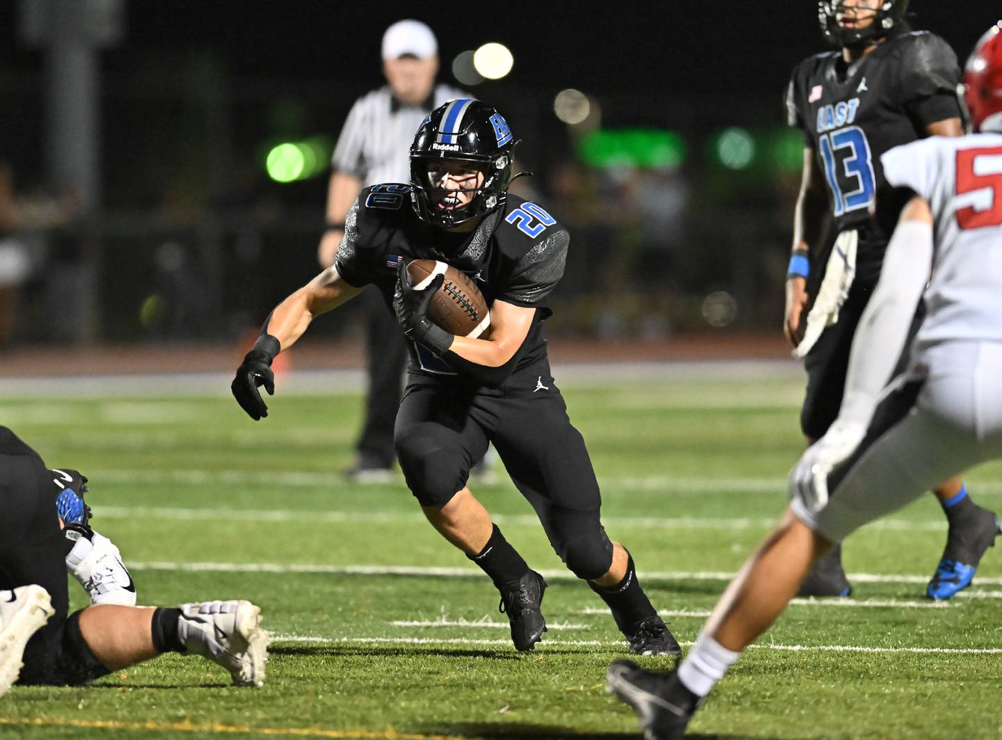 Lincoln-Way East's Brody Gish carries the ball during a non-conference game against Maine South on Friday, Aug. 30, 2024, at Frankfort. (Dean Reid for Shaw Local News Network)