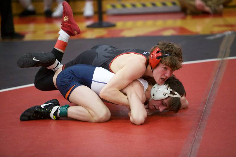 Plainfield North's Maddox Garbis competes with Oswego's Jonathan Theodor in regionals during the 2023-24 postseason.