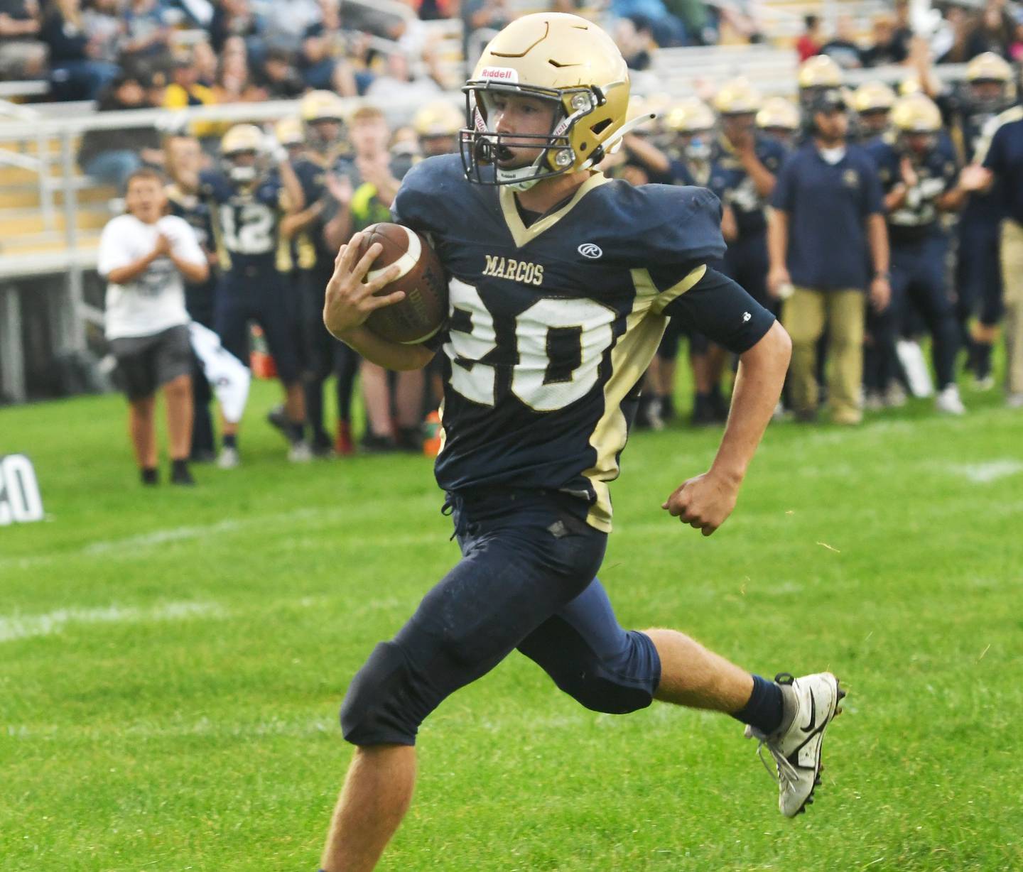 Polo's Avery Grenoble scoots into the end zone for a score during 8-man football action against Orangeville on Saturday, Sept. 3.