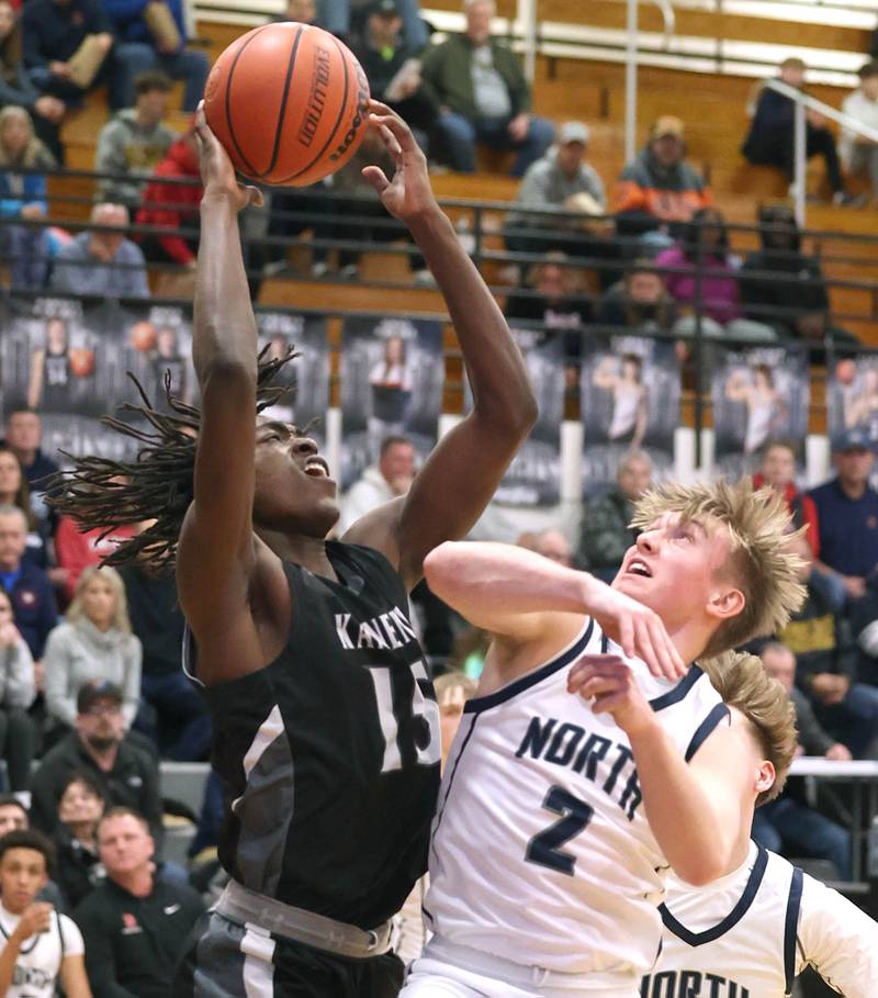 Kaneland's Freddy Hassan grabs a rebound over Belvidere North's Joseph Brown Wednesday, Feb. 28, 2024, during their Class 3A sectional semifinal game at Kaneland High School in Maple Park.