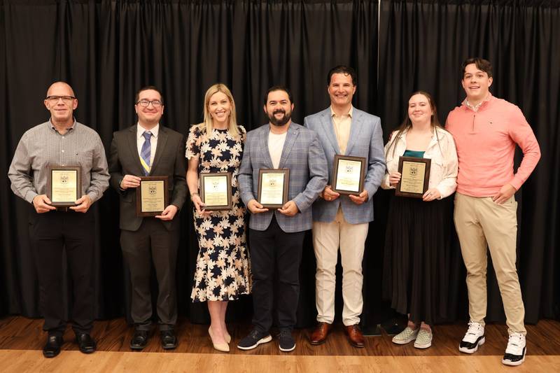 Montini Catholic High School’s alumni association has selected six new members to its Hall of Fame. The induction ceremony was held Saturday, April 13, 2024 in the school’s cafeteria. Pictured (L to R): Tim O'Connor, Paul Kaefer, Shannon Herold Spanos, Sam Vlahos, Dr. Rick Munaretto and Quinn and Griffin Holman