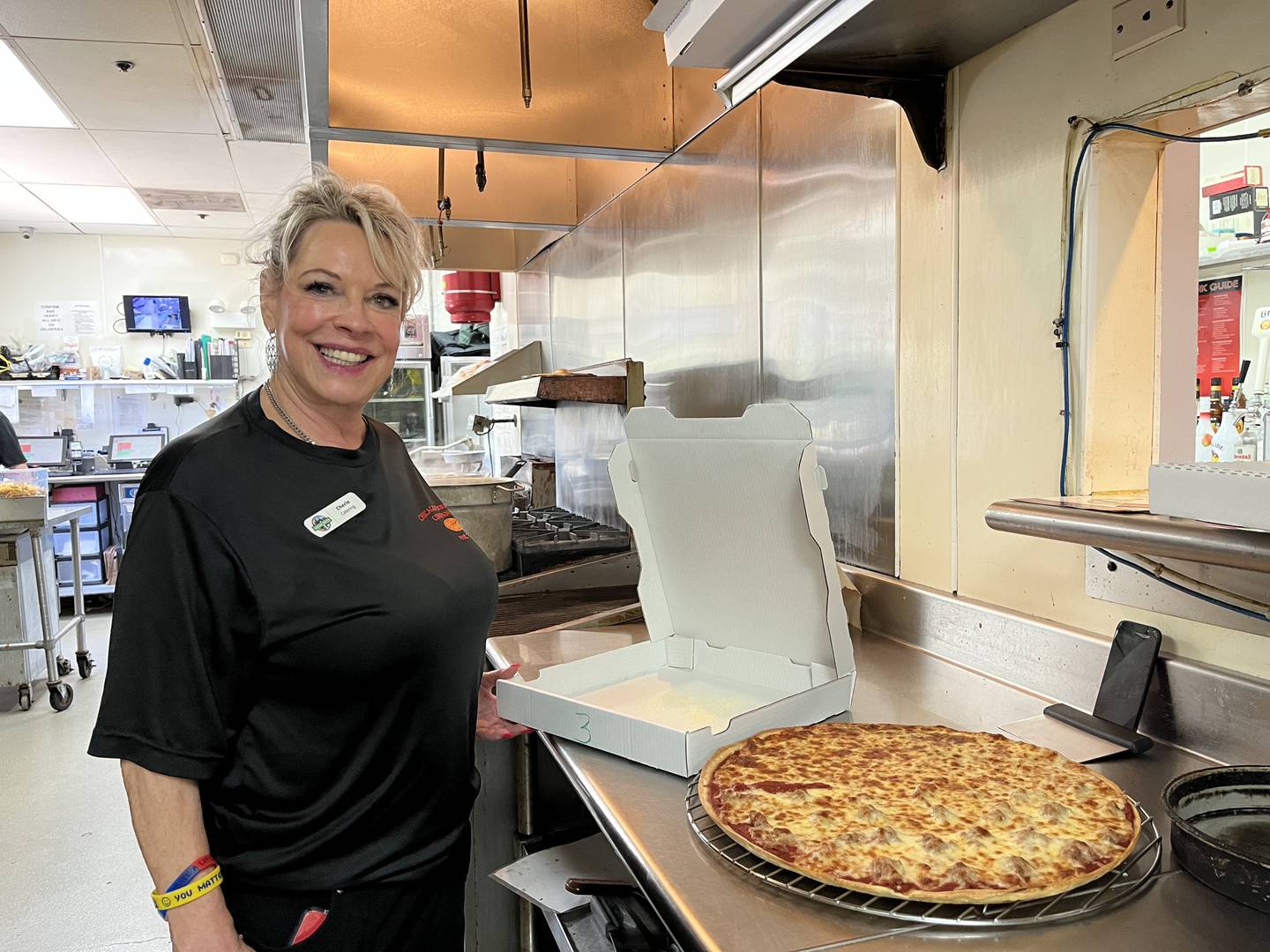 Cherle Link, catering manager for Chicago Dough, 1080 E. Lincoln Highway, New Lenox, seen in the kitchen of the restaurant on Friday, Sept. 1, 2023. Throughout September restaurant will feature pizzas designed by the New Lenox Police Department, the New Lenox Fire Protection District and Laraway Communications Center.