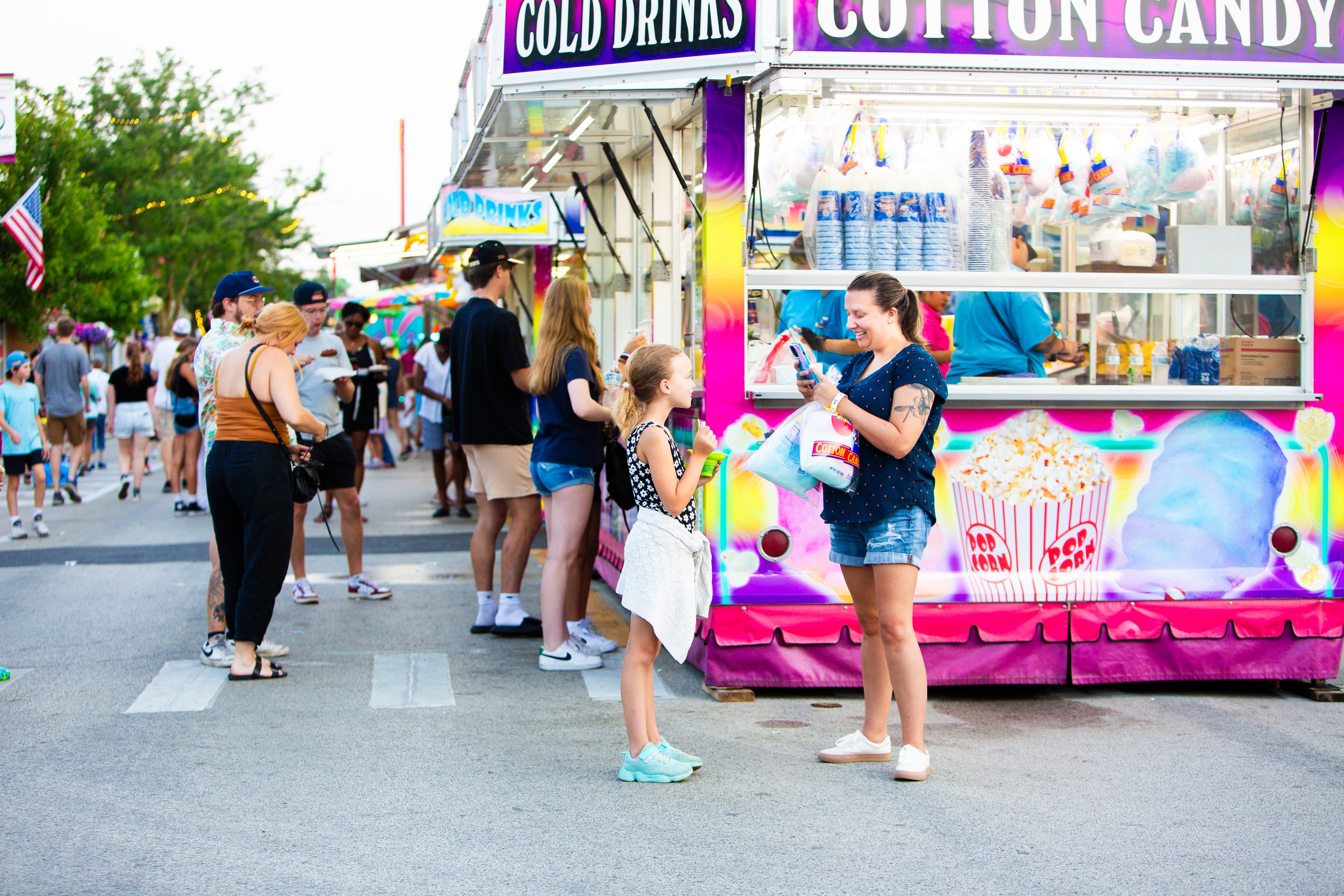 Carey Kogol takes a photo of her daughter Quinn, 8, at The Taste of Westmont on Saturday, July 13.