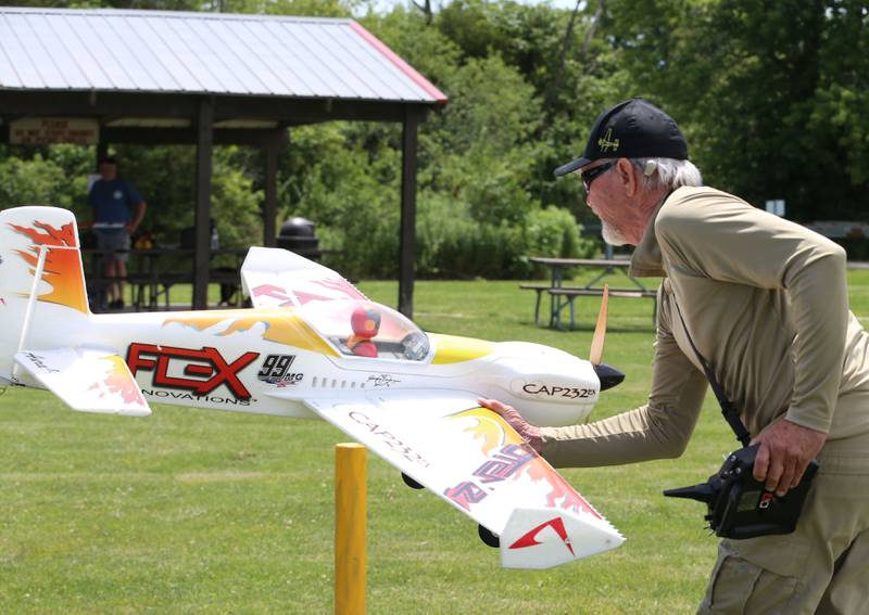 Larry Moore of Oglesby, flies a model airplane on Monday, July 1, 2024 at the Model Airplane Field in Matthiessen State Park.  The Deer Park RC Flyers radio-controlled aircraft club maintains the model airplane field and flies model airplanes at the site.