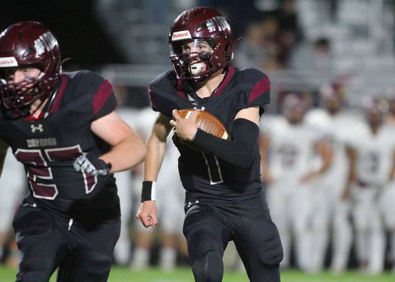 Marengo’s David Lopez runs the ball against Richmond Burton in varsity football at Rod Poppe Field on the campus of Marengo High School in Marengo on Friday, Oct. 18, 2024.