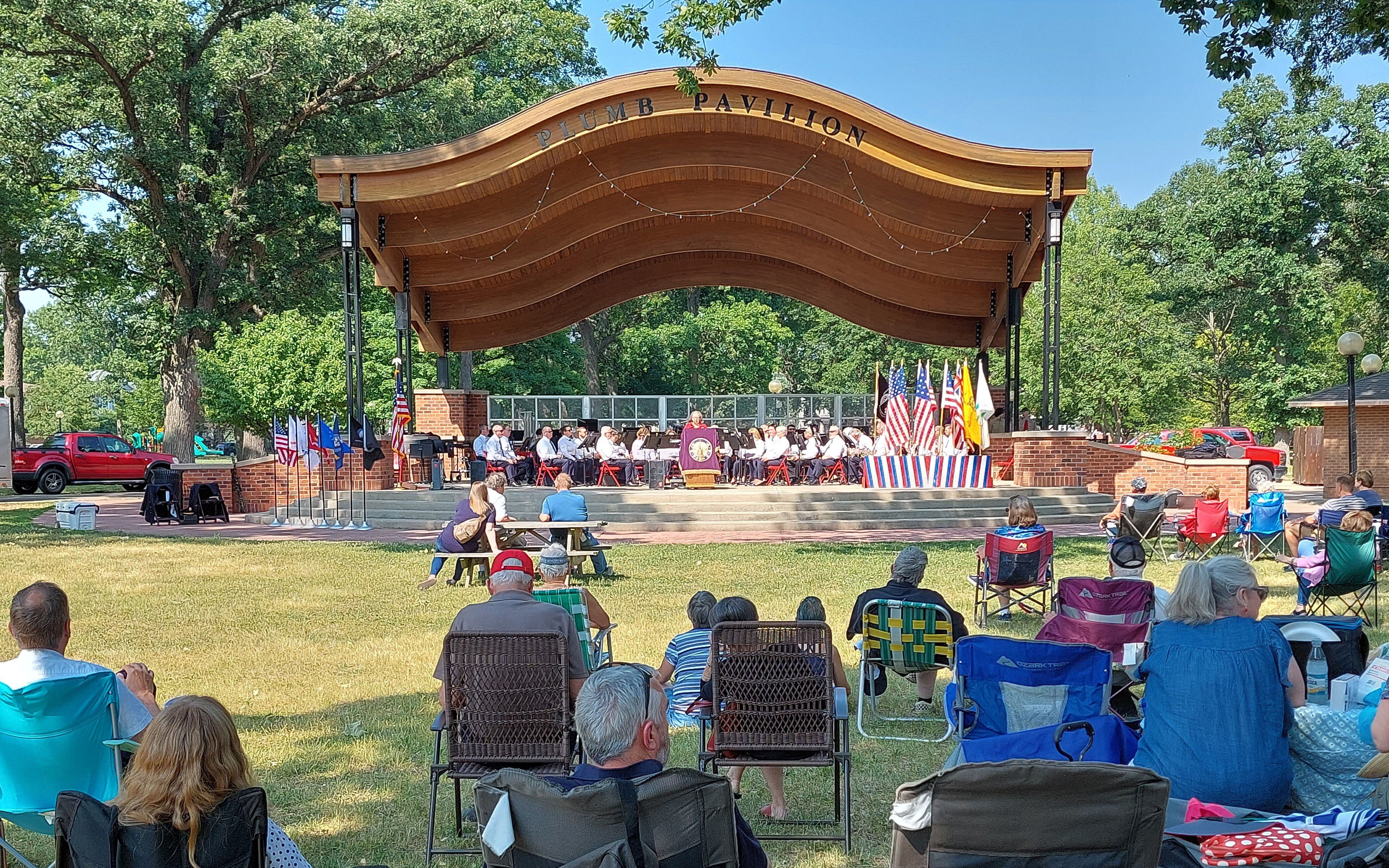 Attendees of the Elks Club Flag Ceremony and performance by the Joliet American Legion Band watch from lawn chairs, blankets and picnic tables Saturday, June 10, 2023, at City Park in Streator.