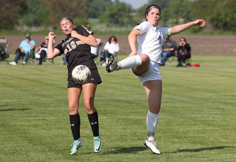 Sycamore's Taylor Zemanek (left) and Woodstock's Natalie Morrow try to win a ball in the air during their Class 2A regional semifinal game Wednesday, May 15, 2024, at Kaneland High School in Maple Park.