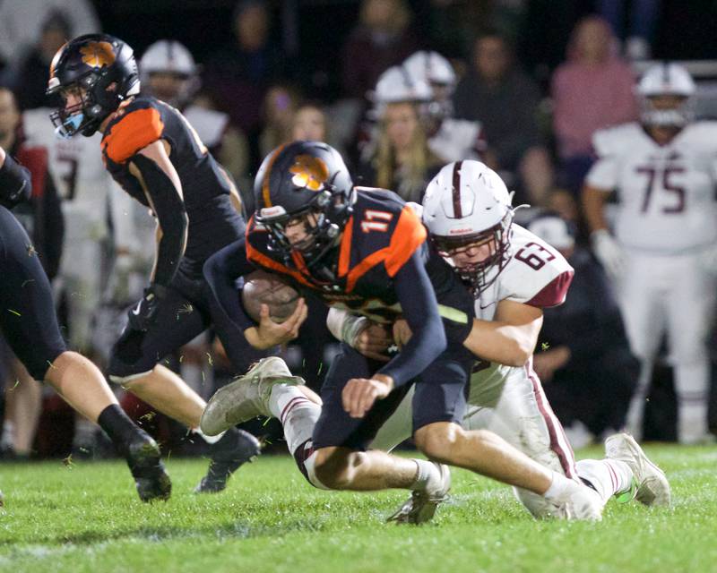 Prairie Ridge's Bob Mugera sacks Crystal Lake Central's Brett Kramer on Friday, Oct.18, 2024 in Crystal Lake.