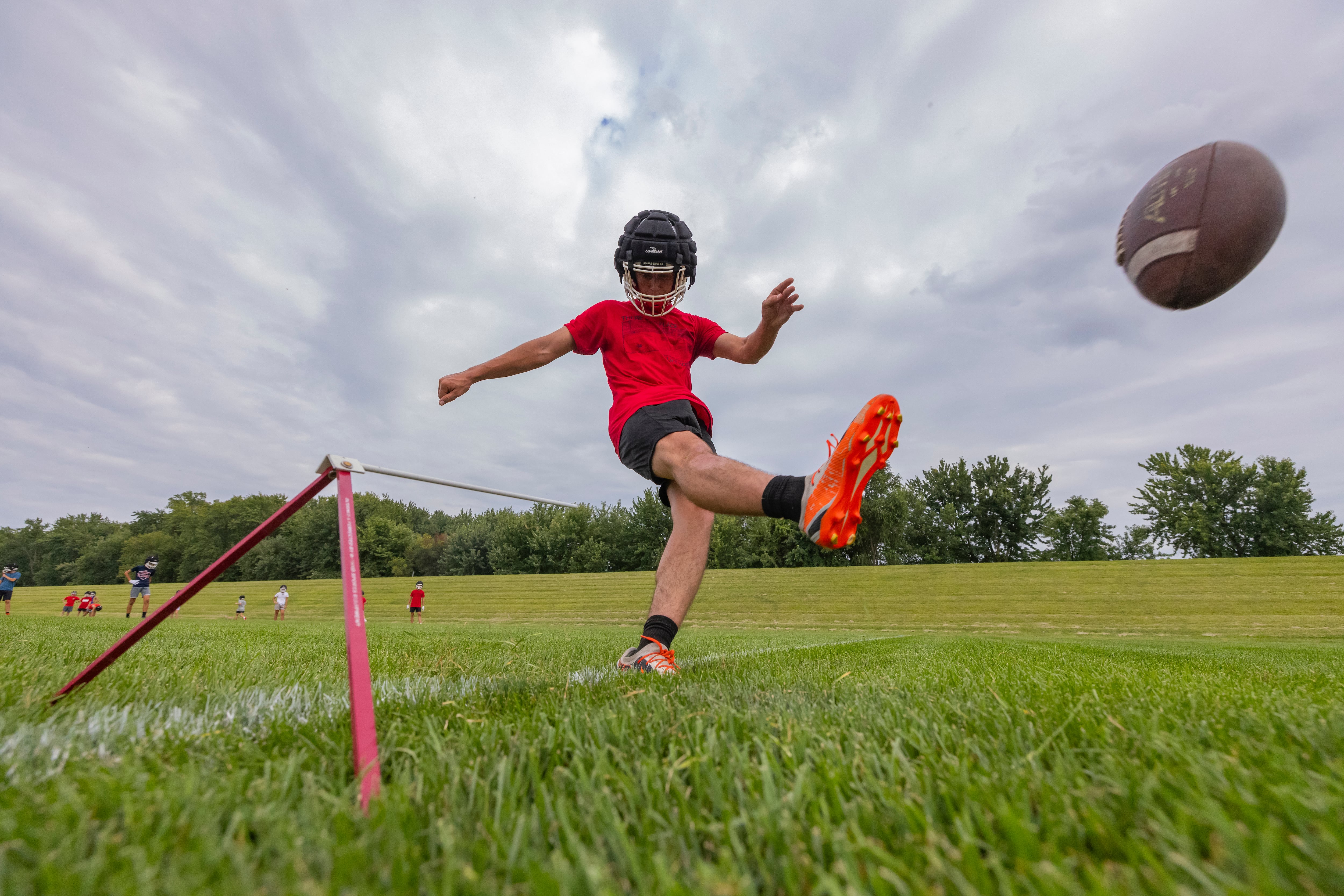 Ottawa kicker Lucas Farabaugh practices field goals during opening football practice day at Ottawa High School on August 12, 2024.