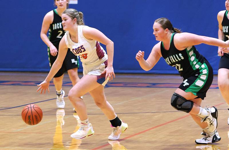 Genoa-Kingston's Arielle Rich pushes the ball ahead of Rock Falls' Denali Stonitsch during their game Friday, Feb. 2, 2024, at Genoa-Kingston High School.