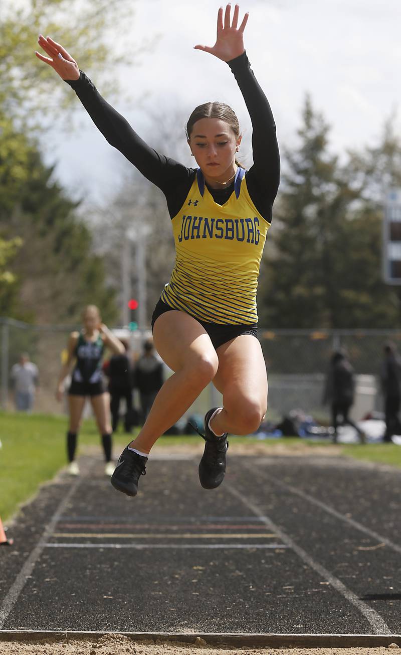 Johnsburg’s Natalie Burke competes in the girls triple jump Friday, April 21, 2023, during the McHenry County Track and Field Meet at Cary-Grove High School.