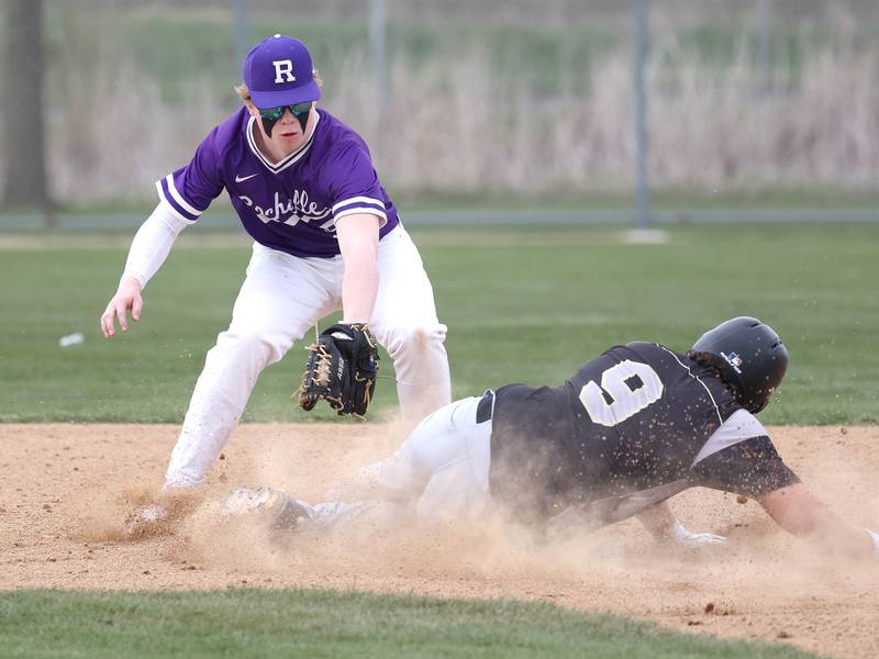 Sycamore's Matthew Rosado slides in with a double under the tag of Rochelle’s Carson Lewis during their game Wednesday, April 10, 2024, at Rochelle High School.