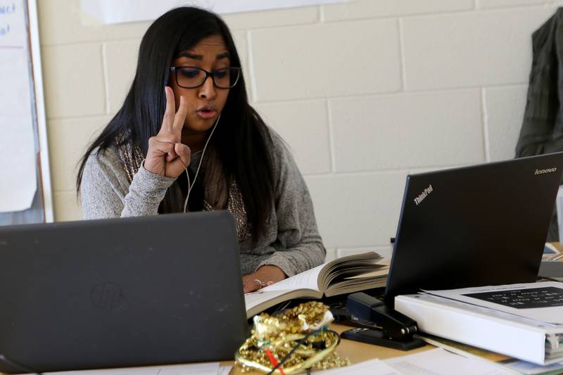 Aurora University student Sunita Andrysiak, a member of the Woodstock Community Unit School District 200 teacher residency program, reads from the book "George's Secret Key to the Universe" Tuesday, March 2, 2021, to her remote students in her fifth-grade dual language English literacy class at Prairiewood Elementary School in Woodstock.