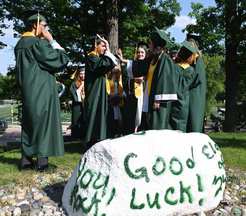 Graduates congregate outside the school prior to the start of the Glenbard West graduation ceremony on Thursday, May 23, 2024 in Glen Ellyn.