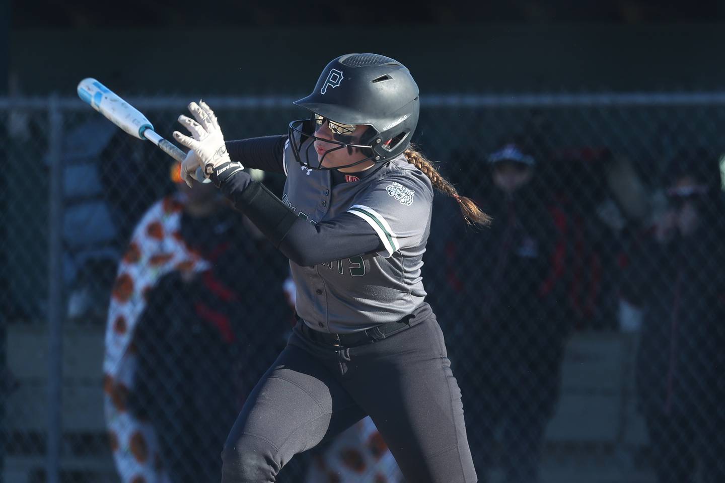 Plainfield Central’s Tricia Hogrefe connects for a RBI single against Bolingbrook on Wednesday, March 20, 2024.