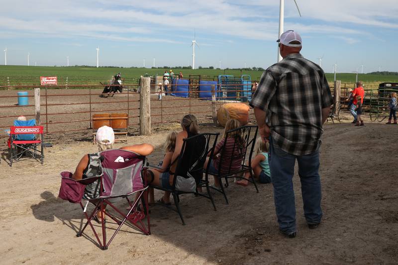 Dominic Dubberstine-Ellerbrock’s family watches the bull riding practice. Dominic will be competing in the 2022 National High School Finals Rodeo Bull Riding event on July 17th through the 23rd in Wyoming. Thursday, June 30, 2022 in Grand Ridge.