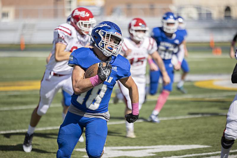 Newman’s Brady Grennan runs the ball against Hall Saturday, Oct. 7, 2023 in Sterling.