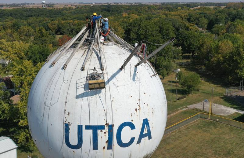 Crews are in the beginning stages of painting the Utica water towner on top of Clarks Hill on Wednesday, Sept. 18, 2024 in Utica. Crews will be doing repairs to the interior and exterior of the tower before painting. When finished, the tower will have a new logo on it.