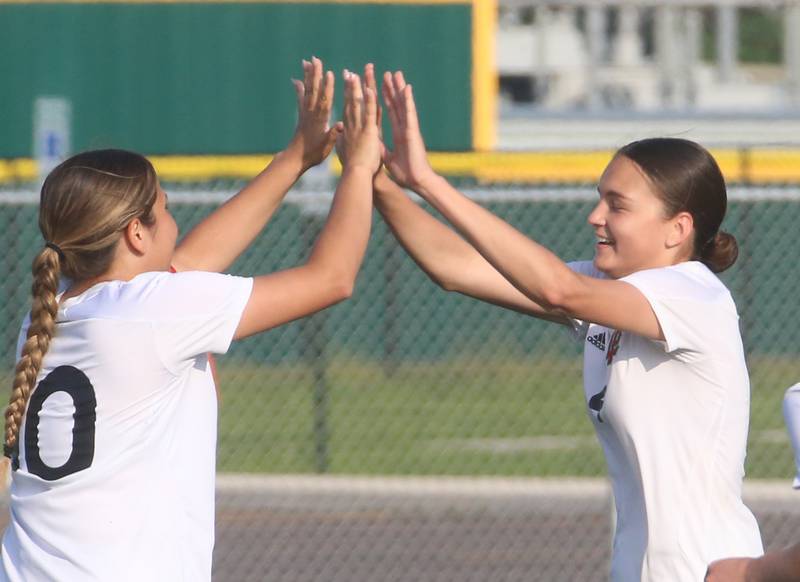 L-P's Litzy Lopez hi-fives teammate Abigal Poole after scoring a goal against Morris during the Class 2A Regional semifinal game on Wednesday, May 15, 2024 at the L-P Athletic Complex in La Salle.