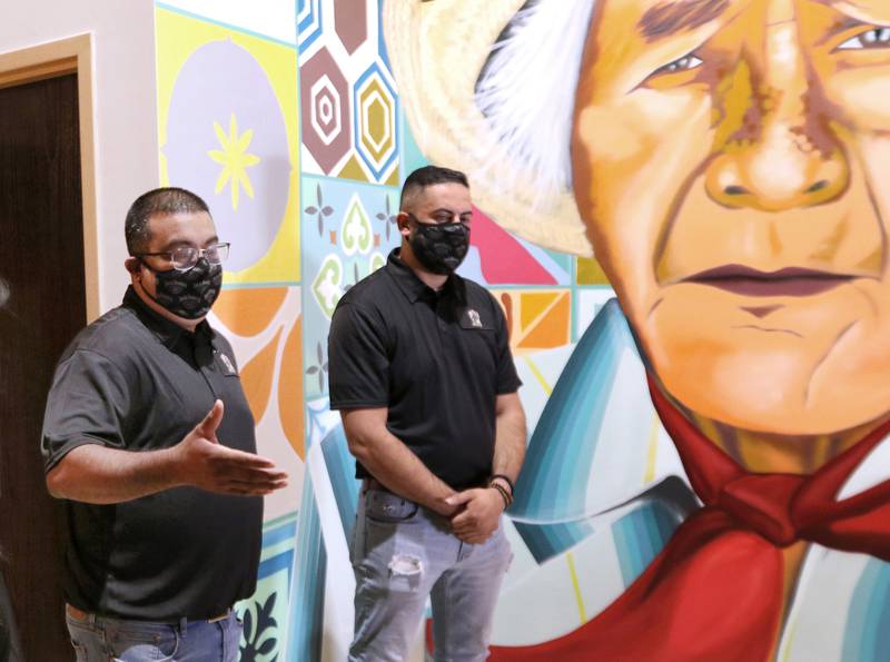 Co-owners Rudy Hernandez and Christopher Cardenas talk about their new restaurant, El Jimador Mexican Grill at 260 E. Lincoln Highway in DeKalb Thursday. The mural in the background was painted by Sycamore artist Brett Whitacre and depicts Rudy Hernandez's grandfather, Tomas Sanches, a jimador, which is is someone that harvests the agave plant. The restaurant is planning to open in the last weekend in September.