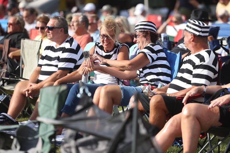 Brad and Donna Weber, left, and Sandy and Jeff Foord dress as prison inmates while listening to Ronnie Baker Brooks at Blues Brothers Con: The Sequel on Saturday, Aug. 17, 2024 at the Old Joliet Prison.