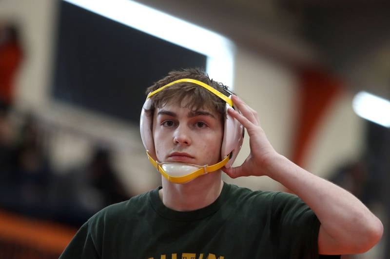 Crystal Lake South’s Josh Glover prepares to enter the ring for the title bout at 113 pounds during IHSA Class 2A regional wrestling at Crystal Lake Central Saturday. Glover won the title over Wauconda’s Gavin Rockey.