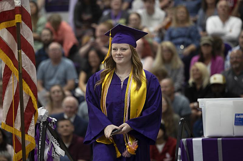 Dixon class of 2024 president Kadence Burger heads for the stage Sunday, May 26, 2024 during commencement.