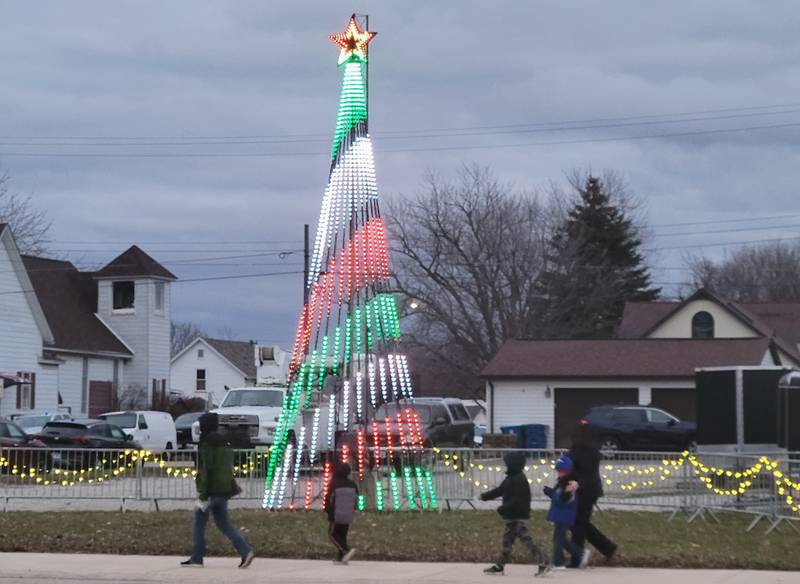 Spectators seek out the best spots along the festive streets for a view of Saturday's Ladd Christmas Parade.