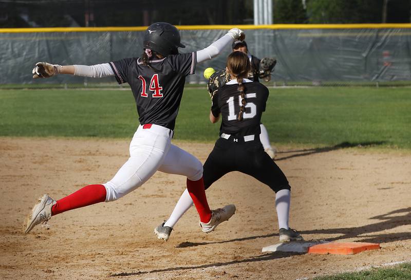 Huntley’s Madison Rozanski tries to beat the throw to Prairie Ridge’s Chloe Lieurance  at first base during a Fox Valley Conference softball game on Monday, April 29, 2024, at Prairie Ridge High School.