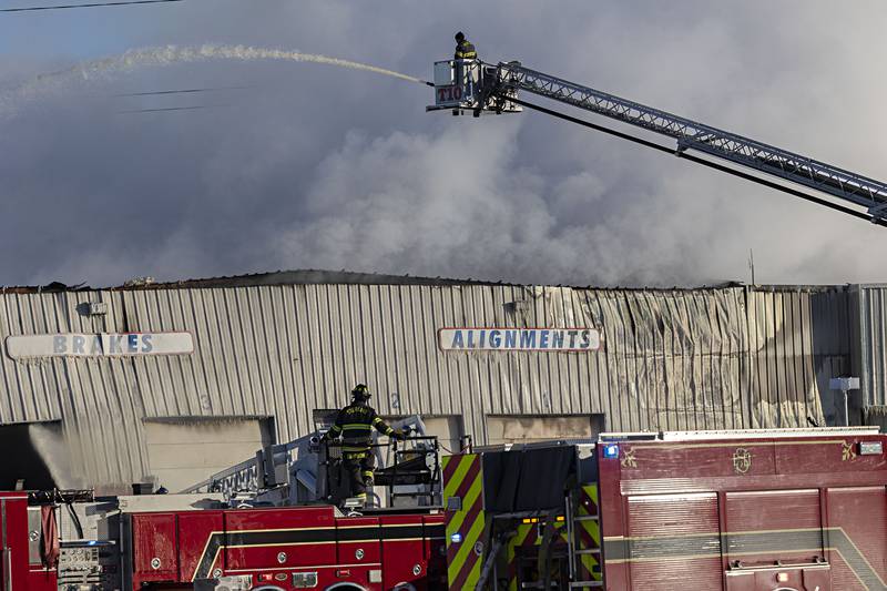 Ladders trucks were needed to get water into the large industrial building Tuesday, Jan. 16, 2024.