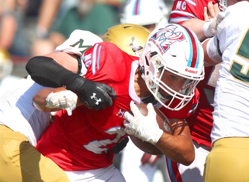 Marian Central’s Nicholas Schmid powers through Bishop McNamara’s defense for a touchdown in varsity football action on Saturday, Sept. 14, 2024, at George Harding Field on the campus of Marian Central High School in Woodstock.