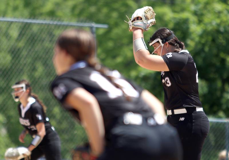 Prairie Ridge’s Reese Mosolino prepares to deliver against Harvard during Class 3A softball regional final action at Lions Park in Harvard Saturday.
