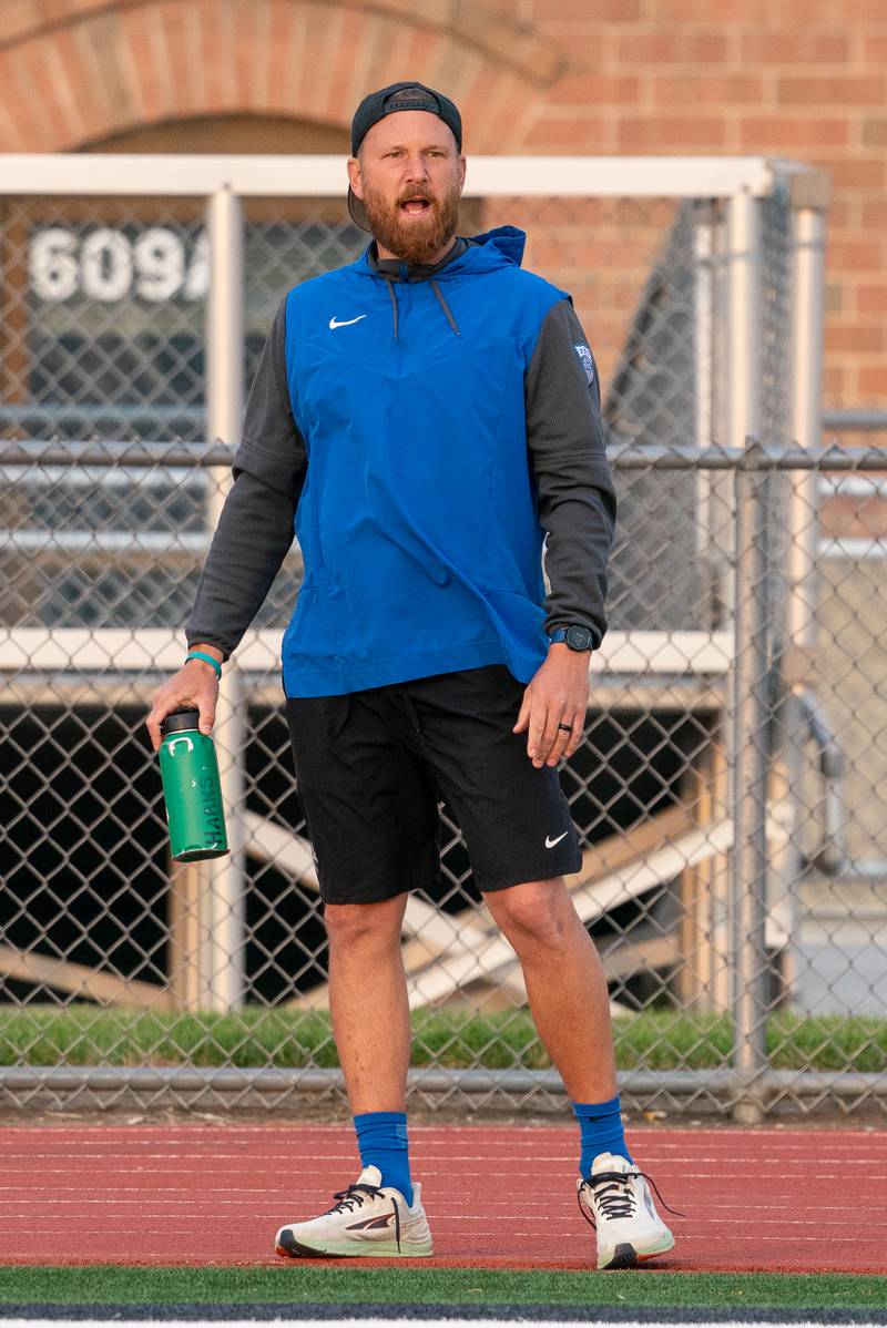 St. Charles North's head coach Brian Harks shouts out instructions to his players during the Class 3A girls soccer regional final against Wheaton Warrenville South at St. Charles North High School on Friday, May 19, 2023.