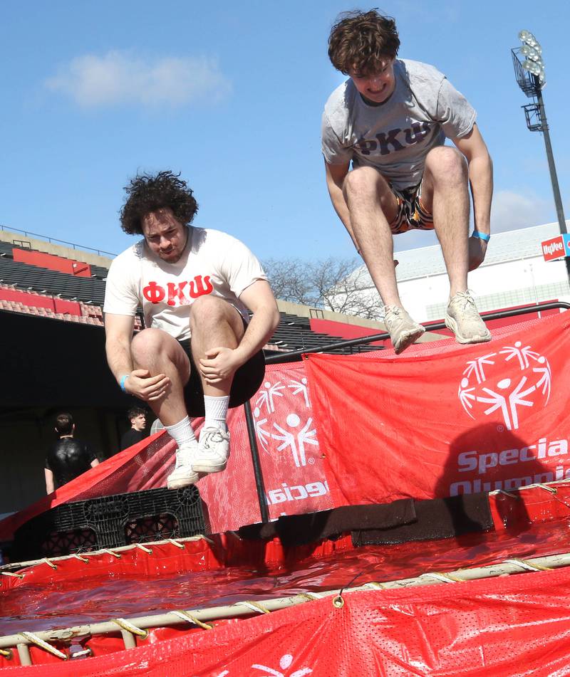 Members of the Phi Kappa Psi fraternity jump into the water on a cold and windy Saturday, Feb 17, 2024, during the Huskie Stadium Polar Plunge at Northern Illinois University in DeKalb. The Polar Plunge is the signature fundraiser for Special Olympics Illinois.