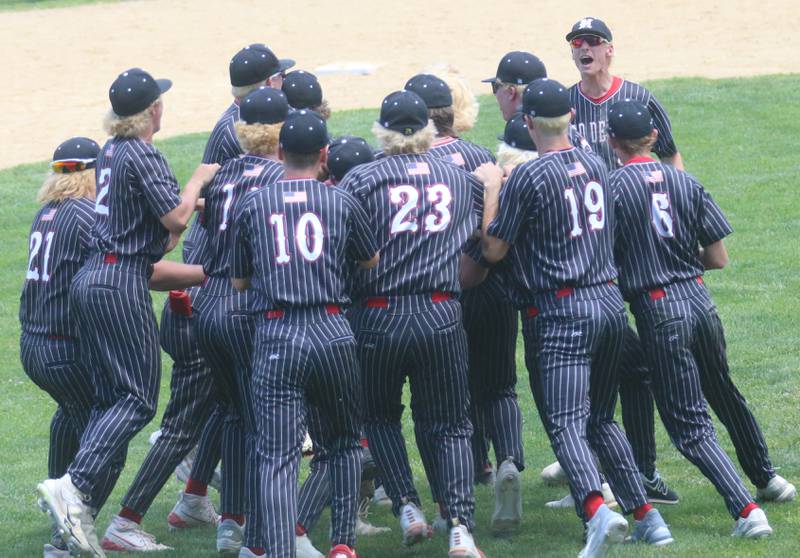 Members of the Hall baseball team meet on the infield after winning the Class 2A Regional title over Chillicothe on Saturday, May 28, 2024 at Kirby Park in Spring Valley.