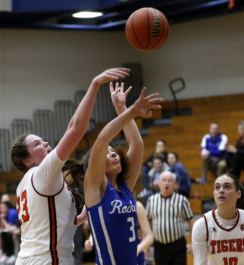 Crystal Lake Central's Leah Spychala blocks the shot of Burlington Central's Savannah Scheuer during the IHSA Class 3A Woodstock Regional Championship girls basketball game on Thursday, Feb. 15, 2024, at Woodstock High School.