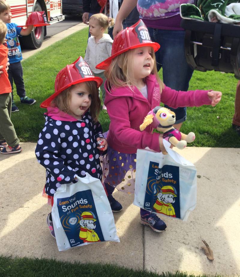 Children visited Wednesday, April 10, 2024, with Ottawa firefighters during National Library Week.