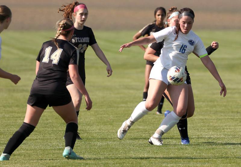 Woodstock's Natalie Morrow holds off Sycamore's Anya Berry during their Class 2A regional semifinal game Wednesday, May 15, 2024, at Kaneland High School in Maple Park.