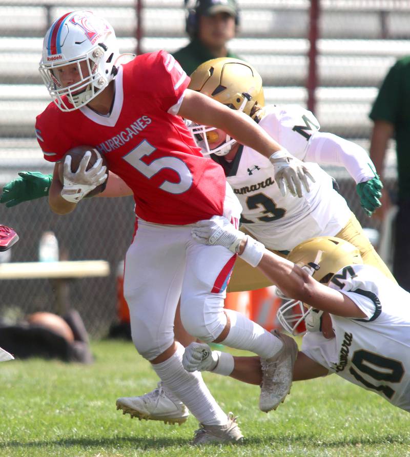 Marian Central’s Michael Schmid runs the ball against Bishop McNamara in varsity football action on Saturday, Sept. 14, 2024, at George Harding Field on the campus of Marian Central High School in Woodstock.