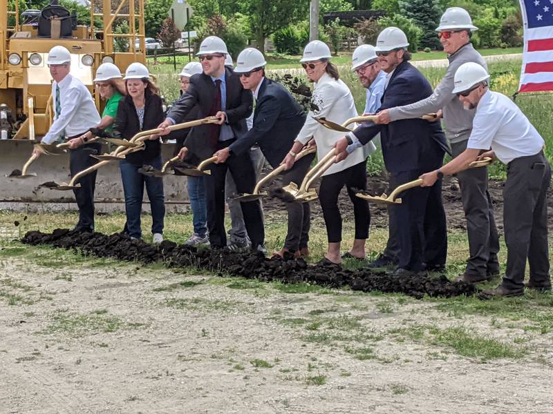 Oswego village officials and D.R. Horton employees help break ground for the 801-unit Sonoma Trails subdivision during a May 29 ceremony.