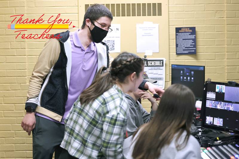 Educator Gregory D'Addario, (left) who teaches english and Spartan TV at Sycamore High School, helps students in the control room during a taping Wednesday, March 1, 2023, at the school.