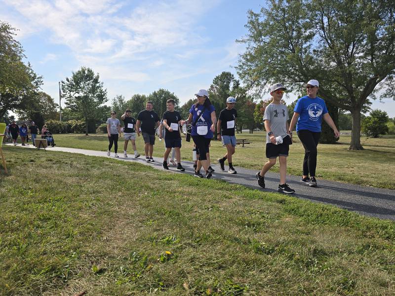 Walkers participate Sunday, Sept. 15, 2024, at the Compassionate Friends Walk to Remember at Baker Lake in Peru.