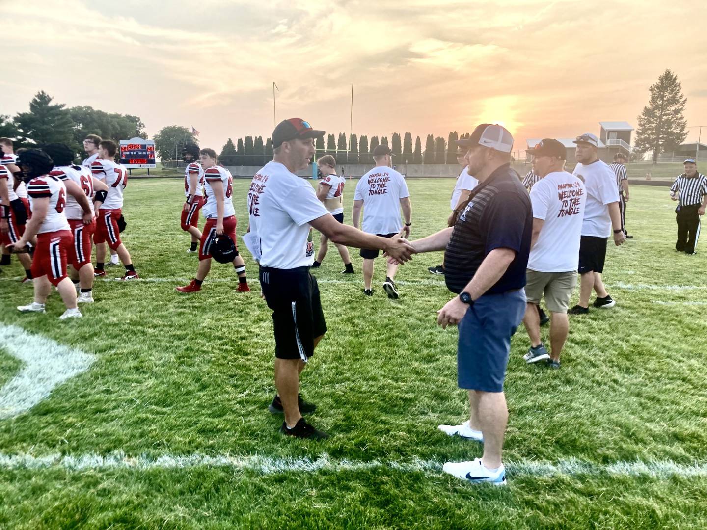 E-P coach Tyler Whitebread (left) and Bureau Valley coach Mat Pistole shake hands after Saturday's Week 0 scrimmage vs. E-P. Both teams kick off off the season Friday.