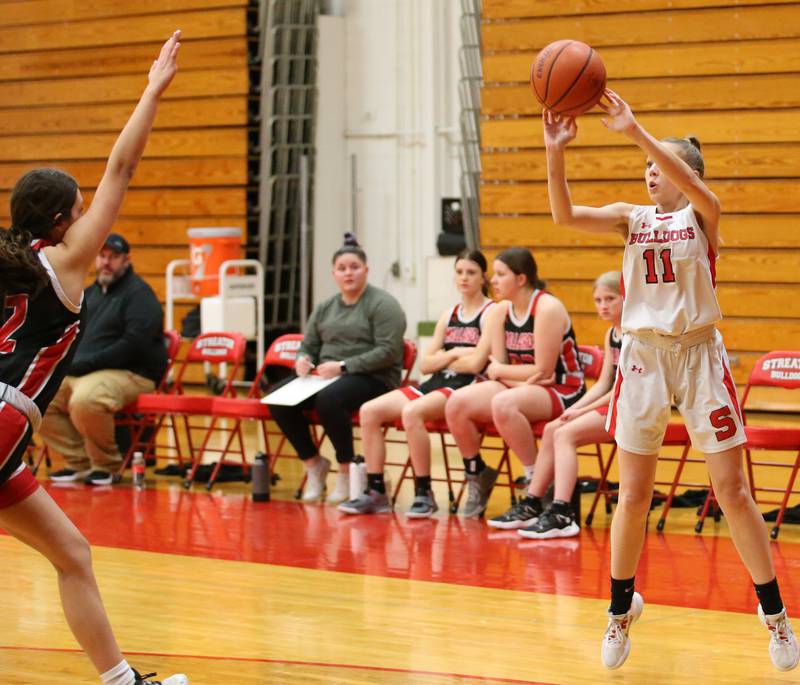 Streator's Cailey Gwaltney shoots a wide-open shot over Henry-Senachwine's Kaitlyn Anderson on Wednesday, Jan,. 4, 2023 at Streator High School.