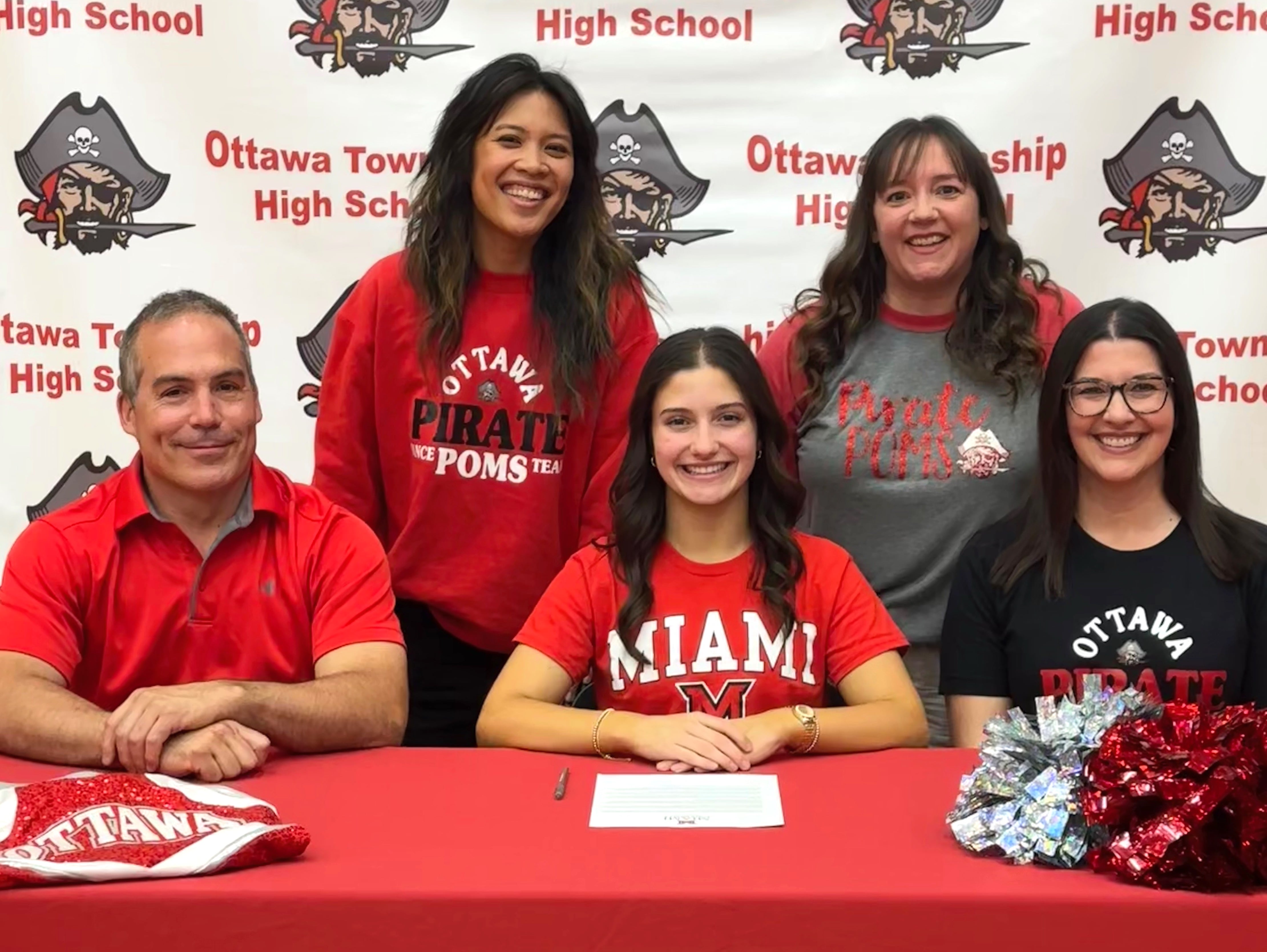 Ottawa’s Sophie Fernandez has signed to continue her education at Miami (of Ohio) University in Oxford, Ohio, and her dance career at the NCAA Division I level with the RedHawks. She is pictured here (seated, at center) at her signing ceremony alongside her family and dance coaches.