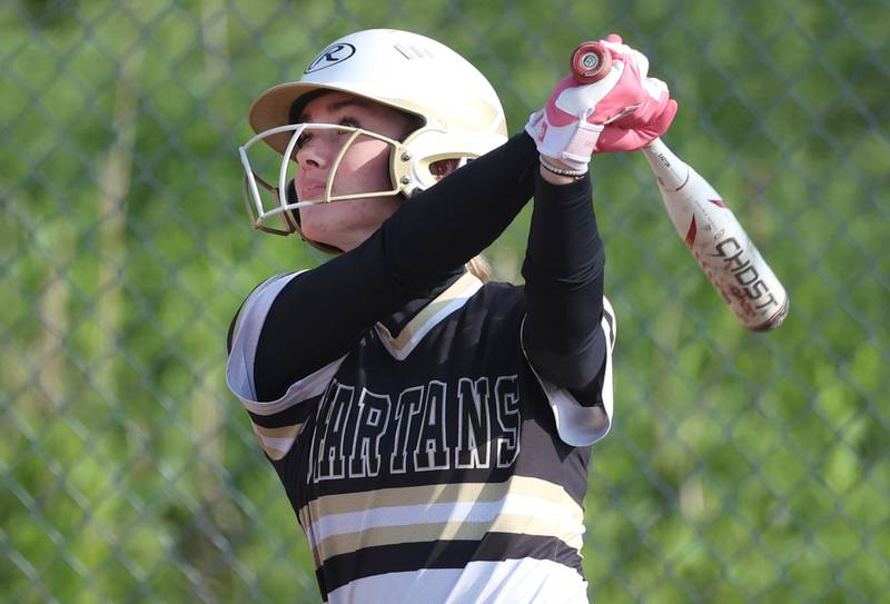 Sycamore's Faith Heil watches the ball fly into left field during their game against Sterling Tuesday, May 14, 2024, at Sycamore High School.