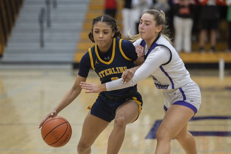 Sterling’s Delali Amankwa works against Dixon’s Reese Dambman Tuesday, Feb. 13, 2024 during a regional semifinal at Rochelle.