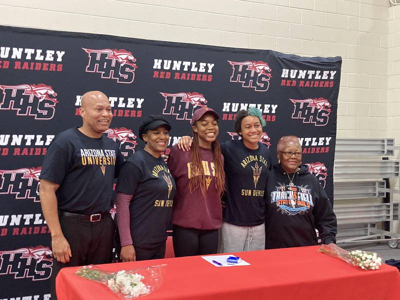 Alex Johnson (middle) stands with (from left) father Alvin Johnson, mother Yolanda Johnson, sister Dominique Johnson and grandmother Mary Hudson.