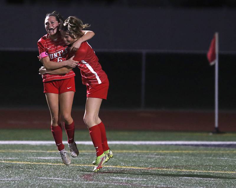 Huntley’s Grace Helzer celebrates with teammate,  Ava Trudeau, after Trudeau scored the winning goal in overtime of a Fox Valley Conference soccer match Thursday, April 13, 2023, at Huntley High School.