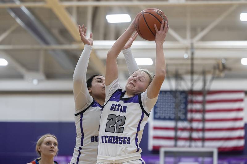 Dixon’s Katie Drew hauls in a rebound against Eastland Wednesday, Jan. 24, 2024 at Dixon High School.